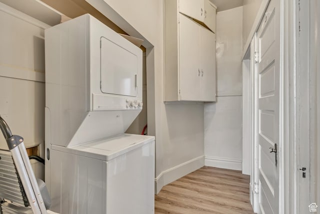 2172 S 800 E, Salt Lake City, UT 84106 - washroom with stacked washer / dryer, light wood-style flooring, and baseboards