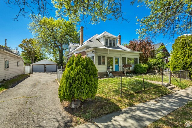 2172 S 800 E, Salt Lake City, UT 84106 - bungalow-style house with a garage, a chimney, a fenced front yard, an outbuilding, and a gate