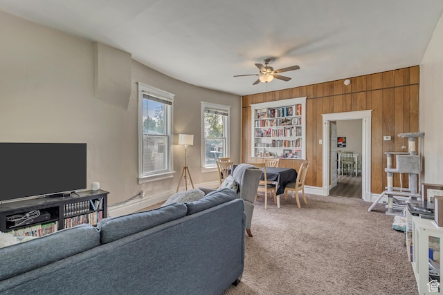 2172 S 800 E, Salt Lake City, UT 84106 - living room with a ceiling fan, carpet flooring, and wooden walls