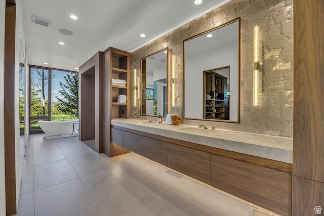 800 Hollyhock St, Park City, UT 84098 - bathroom with recessed lighting, double vanity, a soaking tub, and a wall of windows