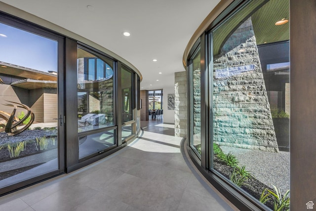 800 Hollyhock St, Park City, UT 84098 - corridor featuring a wall of windows, tile patterned floors, and recessed lighting