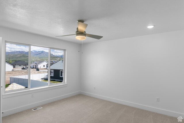 564 N 800 W, Smithfield, UT 84335 - spare room with ceiling fan, light colored carpet, baseboards, and recessed lighting