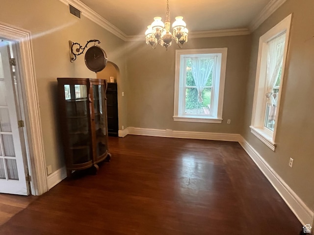 375 E 200 S, Centerville, UT 84014 - unfurnished dining area featuring dark wood-style floors, arched walkways, a chandelier, ornamental molding, and baseboards