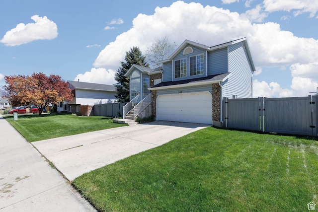 traditional-style house with a gate, an attached garage, and driveway