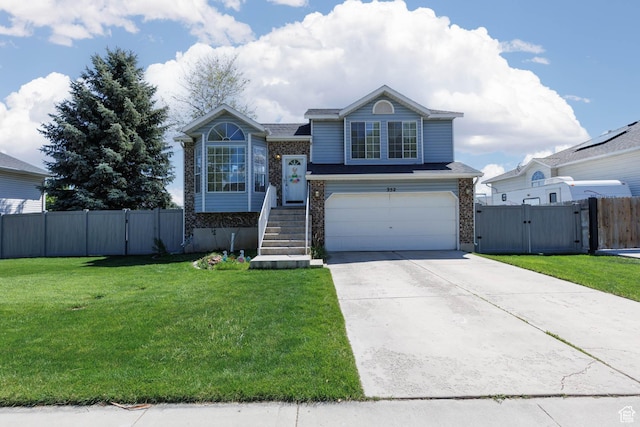 view of front of home with a gate, an attached garage, and driveway
