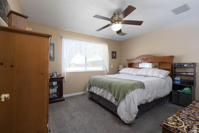 carpeted bedroom with baseboards and a ceiling fan