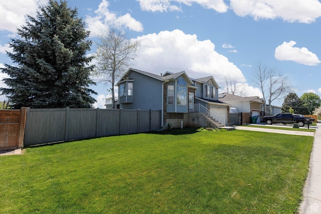view of side of property with concrete driveway and a garage