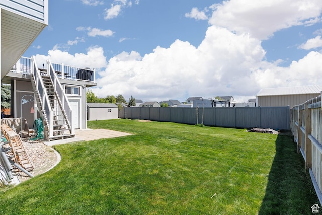 view of yard featuring stairs and a patio