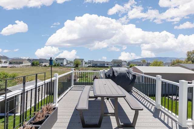 wooden deck featuring a residential view