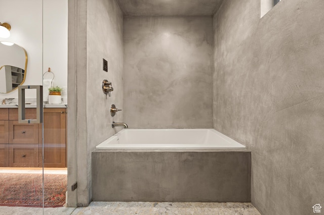 10076 S Wild Goose Cv E, Sandy, UT 84092 - bathroom featuring a tub with marble appearance, vanity, and a shower