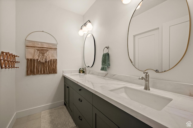 10076 S Wild Goose Cv E, Sandy, UT 84092 - full bath with double vanity, baseboards, and tile patterned floors