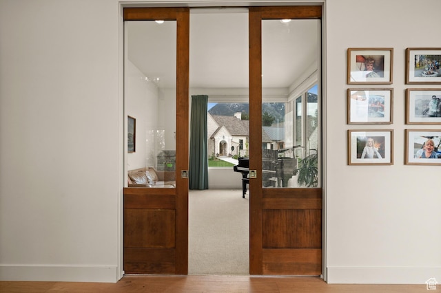 10076 S Wild Goose Cv E, Sandy, UT 84092 - entryway featuring baseboards and wood finished floors