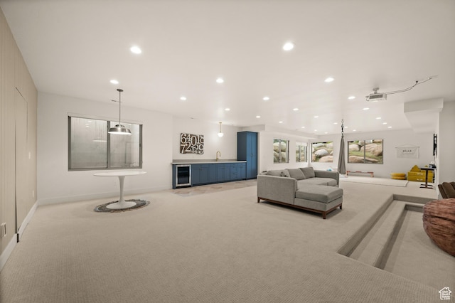 10076 S Wild Goose Cv E, Sandy, UT 84092 - living area with bar with sink, light carpet, recessed lighting, baseboards, and wine cooler