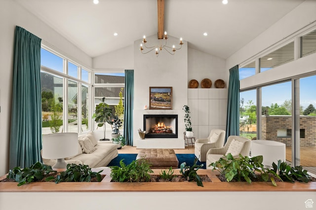 10076 S Wild Goose Cv E, Sandy, UT 84092 - living room with beam ceiling, a lit fireplace, a chandelier, high vaulted ceiling, and recessed lighting