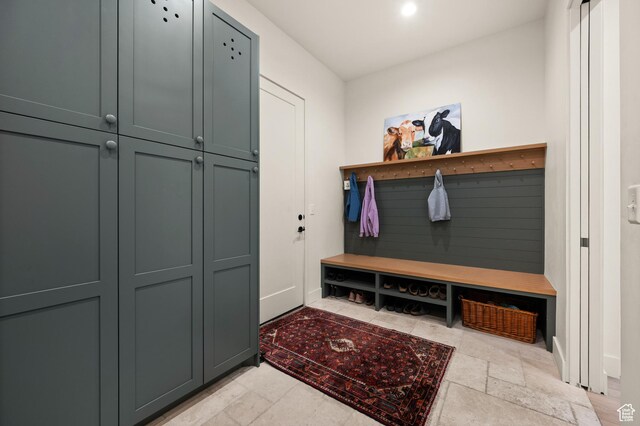 10076 S Wild Goose Cv E, Sandy, UT 84092 - mudroom featuring stone tile flooring and baseboards