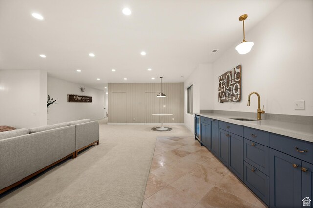 10076 S Wild Goose Cv E, Sandy, UT 84092 - kitchen featuring a sink, recessed lighting, open floor plan, light countertops, and blue cabinets