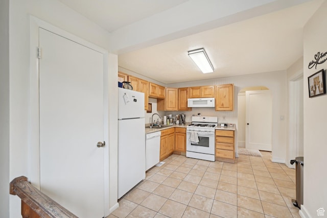 230 S 600 E, Provo, UT 84606 - kitchen with white appliances, light countertops, light brown cabinets, a sink, and arched walkways