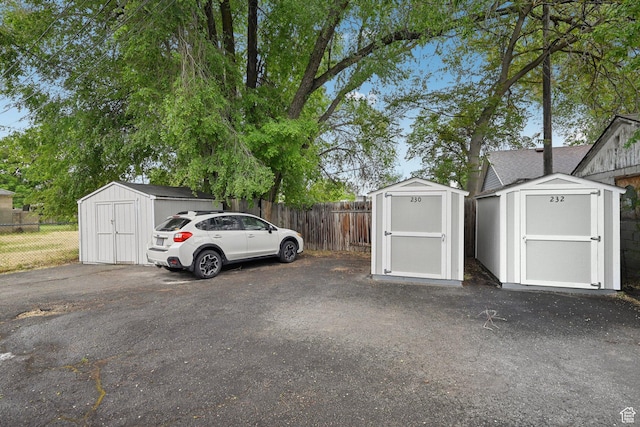 230 S 600 E, Provo, UT 84606 - view of parking with a storage unit and fence