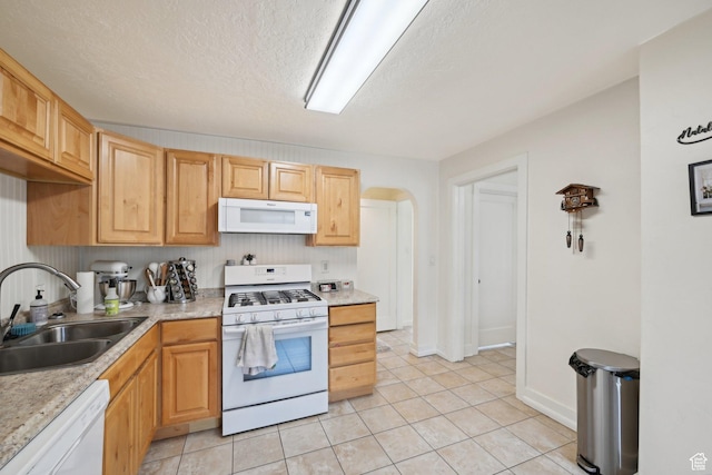 230 S 600 E, Provo, UT 84606 - kitchen with white appliances, a sink, light countertops, arched walkways, and a textured ceiling
