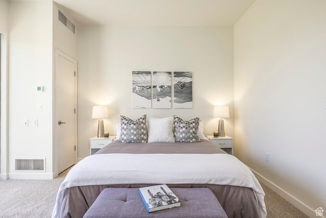 bedroom with carpet floors and baseboards