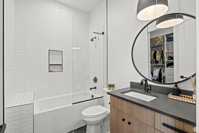 full bathroom featuring toilet, tub / shower combination, and vanity