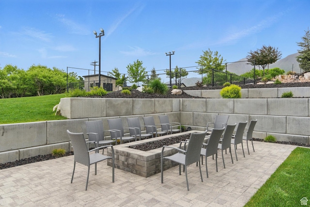 view of patio / terrace featuring an outdoor fire pit
