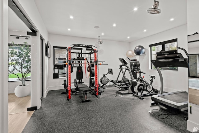 workout area featuring plenty of natural light, recessed lighting, and baseboards