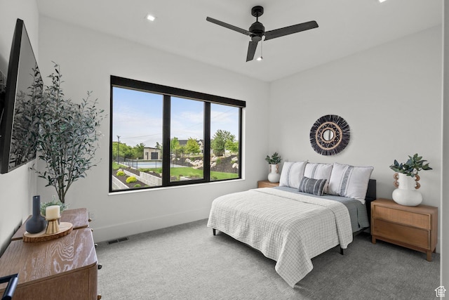 carpeted bedroom with baseboards, ceiling fan, and recessed lighting