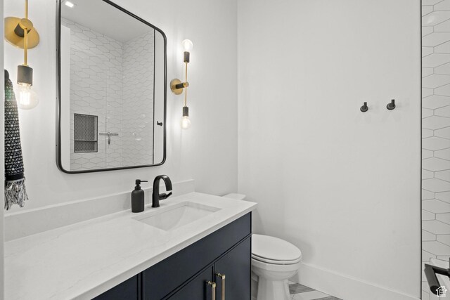 bathroom with toilet and vanity