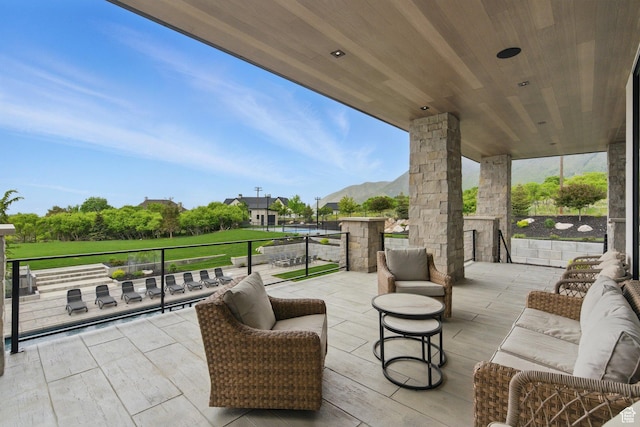 view of patio / terrace with outdoor lounge area and a mountain view