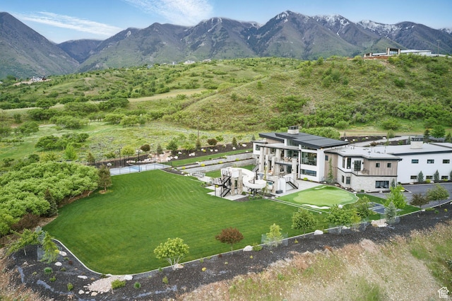 view from above of property with a mountain backdrop