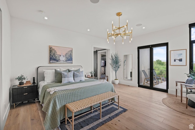 bedroom featuring access to outside, light wood finished floors, multiple windows, and recessed lighting
