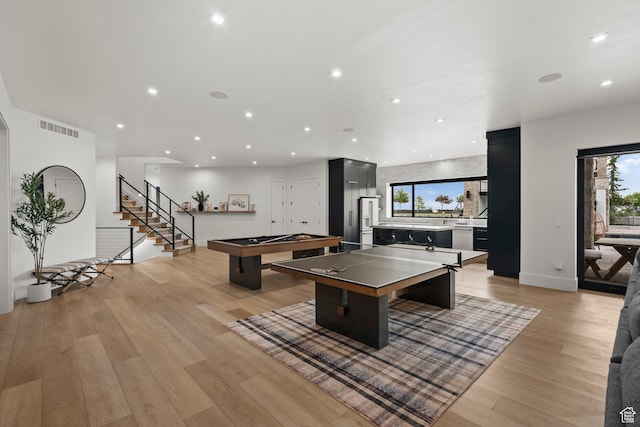 recreation room with healthy amount of natural light, recessed lighting, light wood-style flooring, billiards, and baseboards