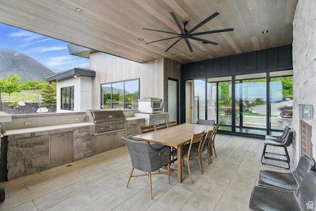 sunroom featuring a mountain view and healthy amount of natural light