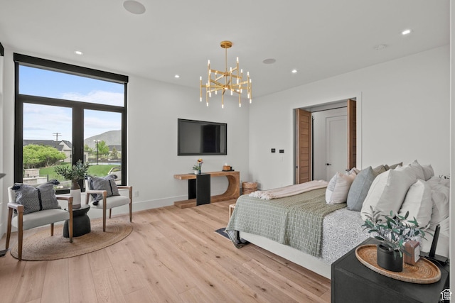 bedroom featuring a chandelier, light wood-type flooring, recessed lighting, and baseboards