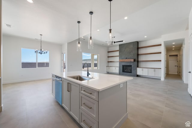 kitchen with a sink, a chandelier, dishwasher, plenty of natural light, and recessed lighting