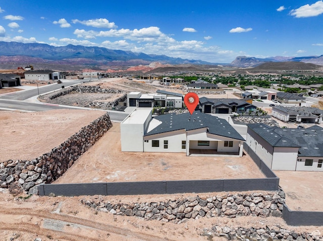 aerial perspective of suburban area with a mountainous background