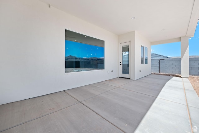 view of patio / terrace featuring fence