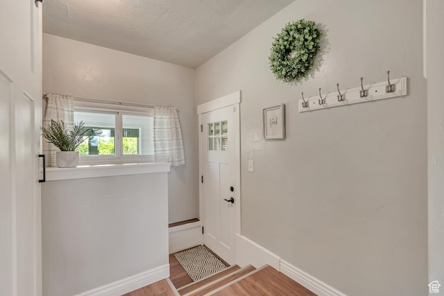 120 N 5th St, Tooele, UT 84074 - doorway with wood finished floors and baseboards