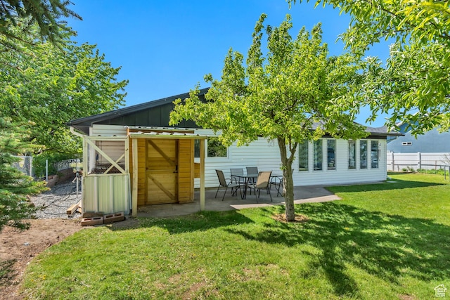 120 N 5th St, Tooele, UT 84074 - back of house with board and batten siding and a patio area