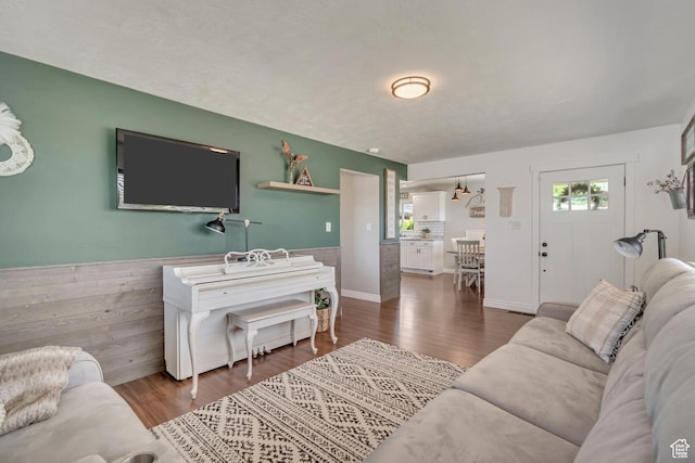 120 N 5th St, Tooele, UT 84074 - living area featuring healthy amount of natural light, dark wood-style floors, and wainscoting