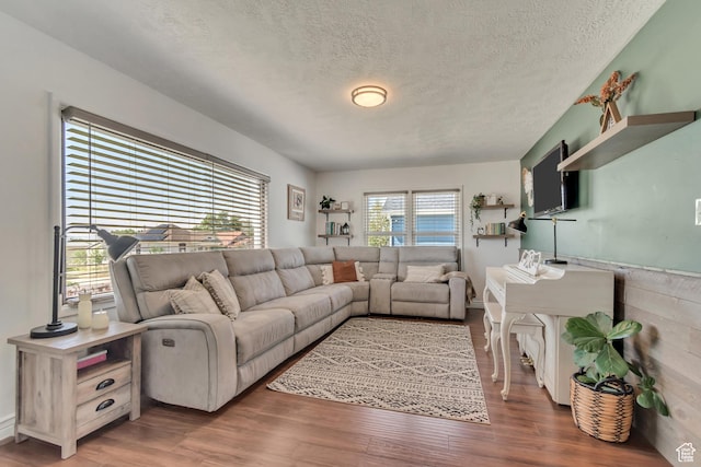 120 N 5th St, Tooele, UT 84074 - living area featuring a textured ceiling and wood finished floors