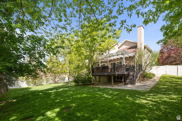view of yard with a patio, stairway, a pergola, and a deck