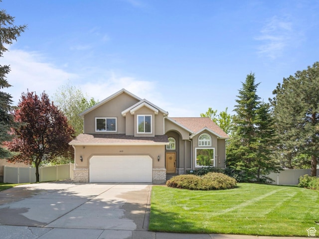view of front of home featuring stucco siding, concrete driveway, a garage, and stone siding