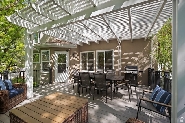 deck with grilling area, a pergola, and outdoor dining area