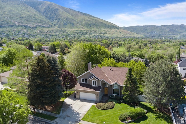 view of subject property with a mountainous background