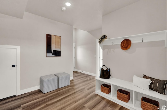mudroom featuring light wood finished floors and baseboards