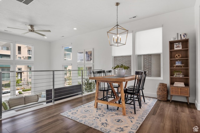 dining room with a chandelier, ceiling fan, wood finished floors, and recessed lighting