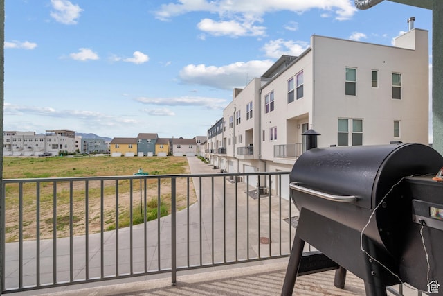 balcony featuring area for grilling and a residential view