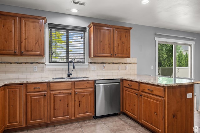 1066 W 1325 S, Springville, UT 84663 - kitchen with stainless steel dishwasher, a sink, a peninsula, brown cabinetry, and recessed lighting